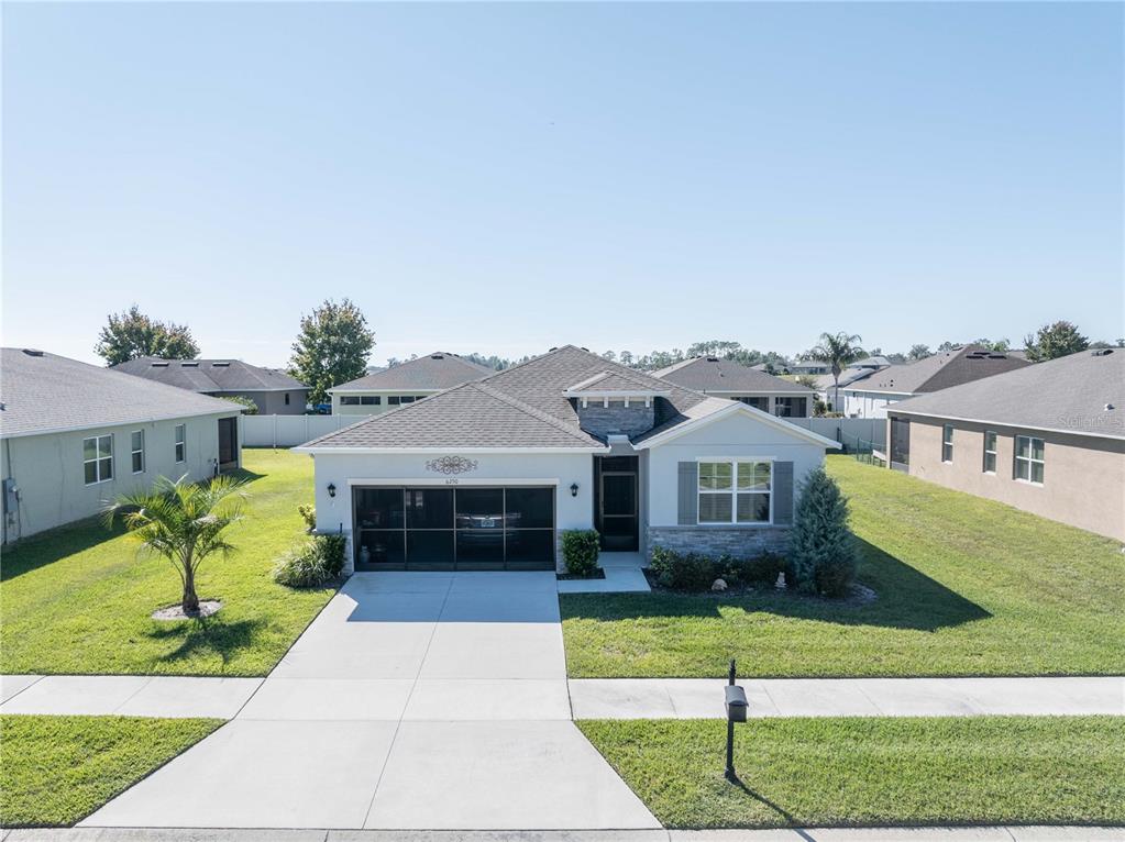6250 Southwest 89th Ln Road Ocala, FL 34476 - Photo 8 of 71 a front view of house with garage and yard