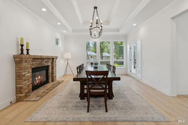 a spacious bedroom with a bed and a fireplace