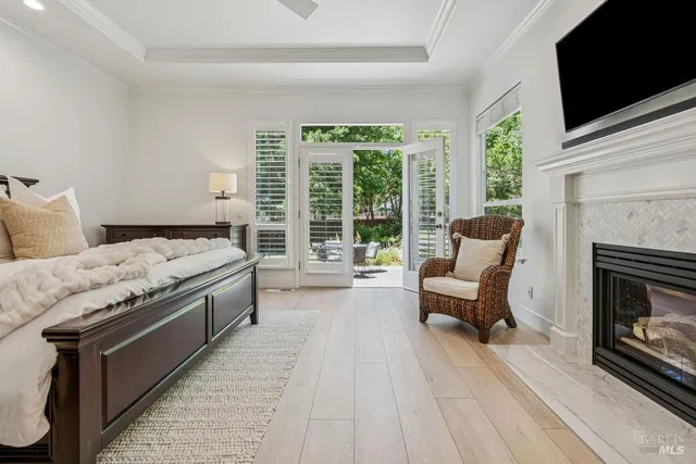 a white bath tub sitting next to a shower