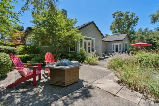 a bedroom with a bed and large window