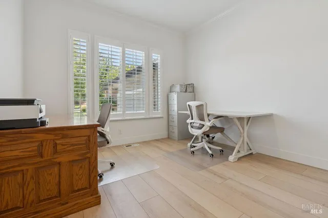 a bathroom with a granite countertop sink toilet a mirror and shower