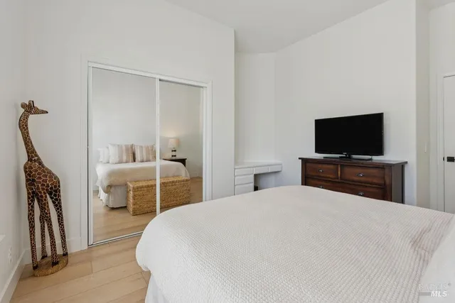 a view of a patio with a table and chairs under an umbrella