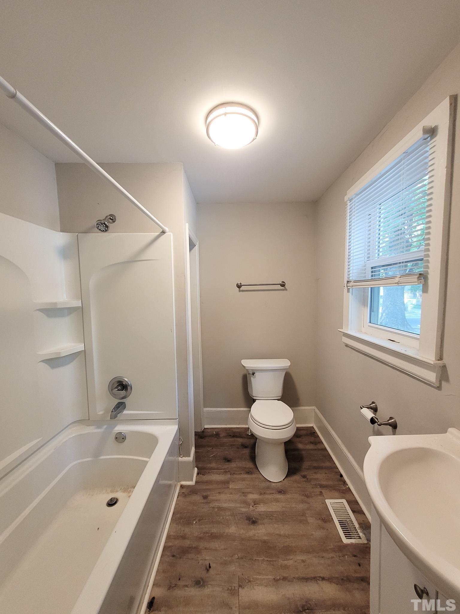 802 Park Avenue, Unit B Durham, NC 27703 - Photo 13 of 23 a bathroom with a sink and a bathtub