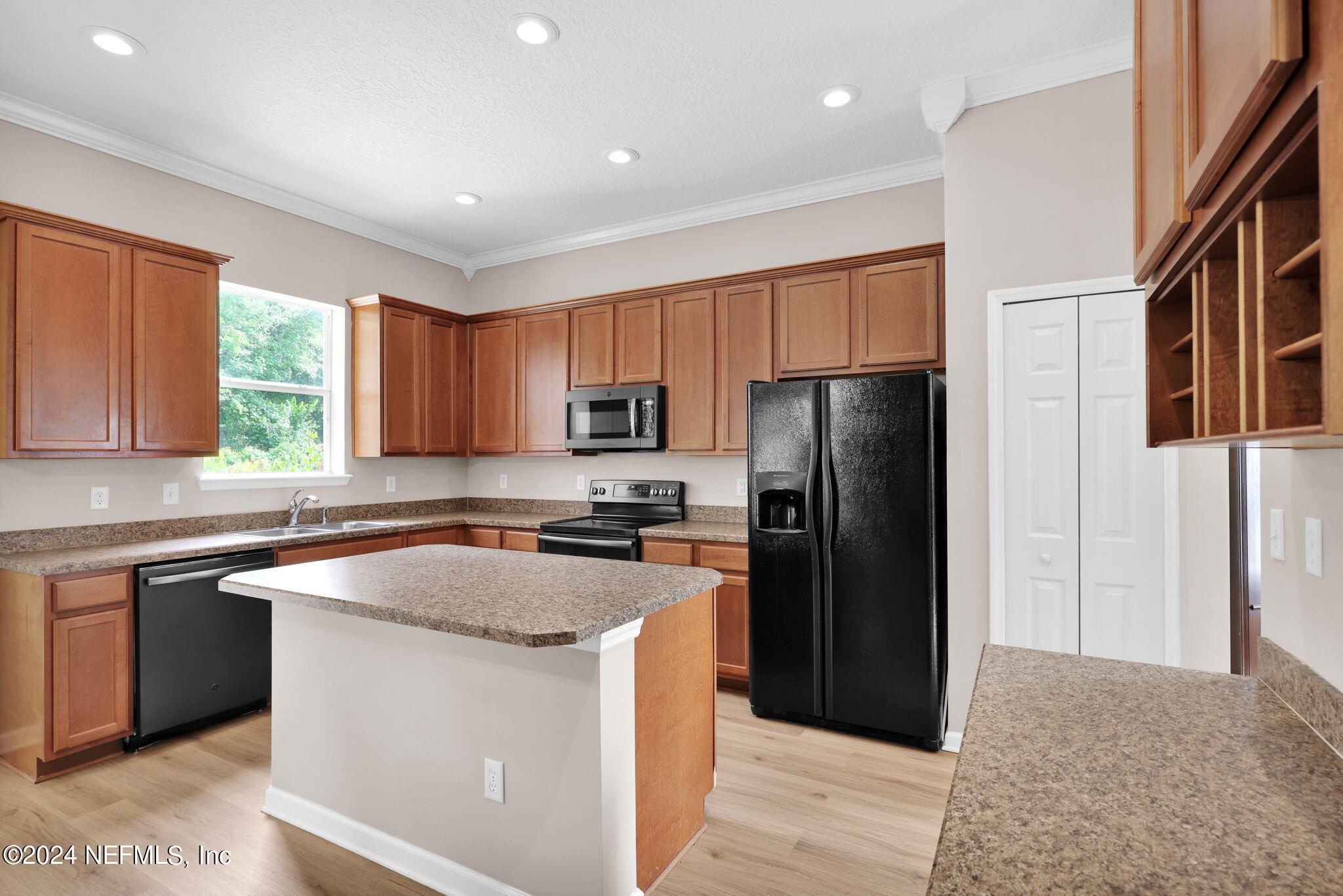 137 Castlegate Lane St. Johns, FL 32259 - Photo 14 of 65 a kitchen with a refrigerator a sink a stove a microwave and cabinets