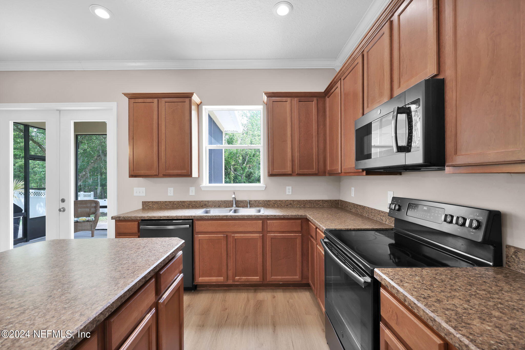 137 Castlegate Lane St. Johns, FL 32259 - Photo 17 of 65 a kitchen with stainless steel appliances granite countertop a sink stove and cabinets
