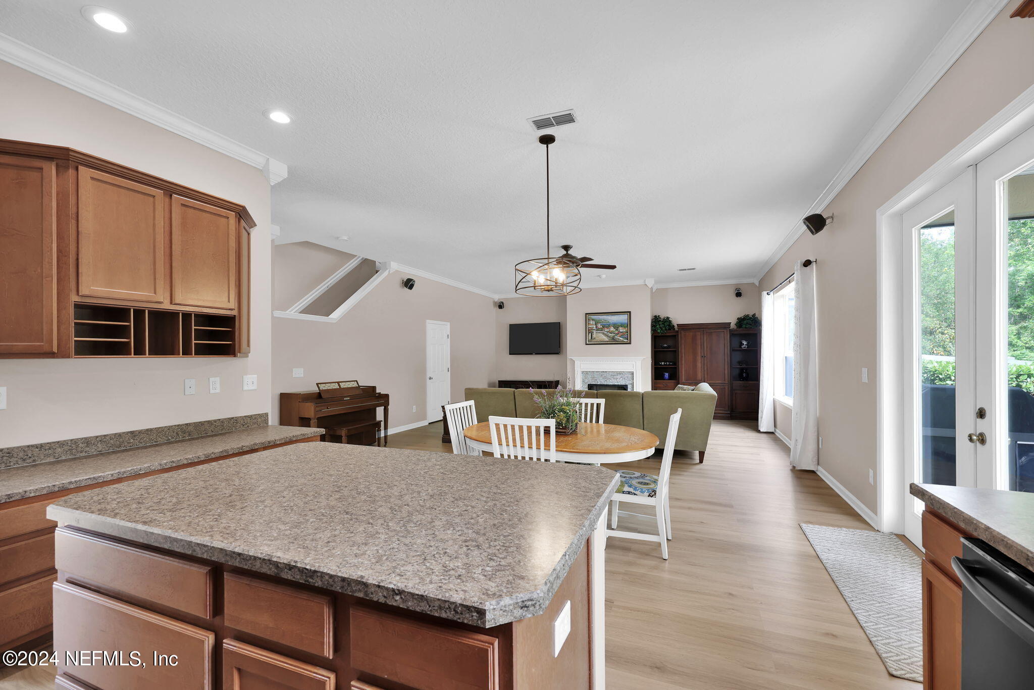 137 Castlegate Lane St. Johns, FL 32259 - Photo 18 of 65 a view of a dining room and livingroom with furniture wooden floor a chandelier