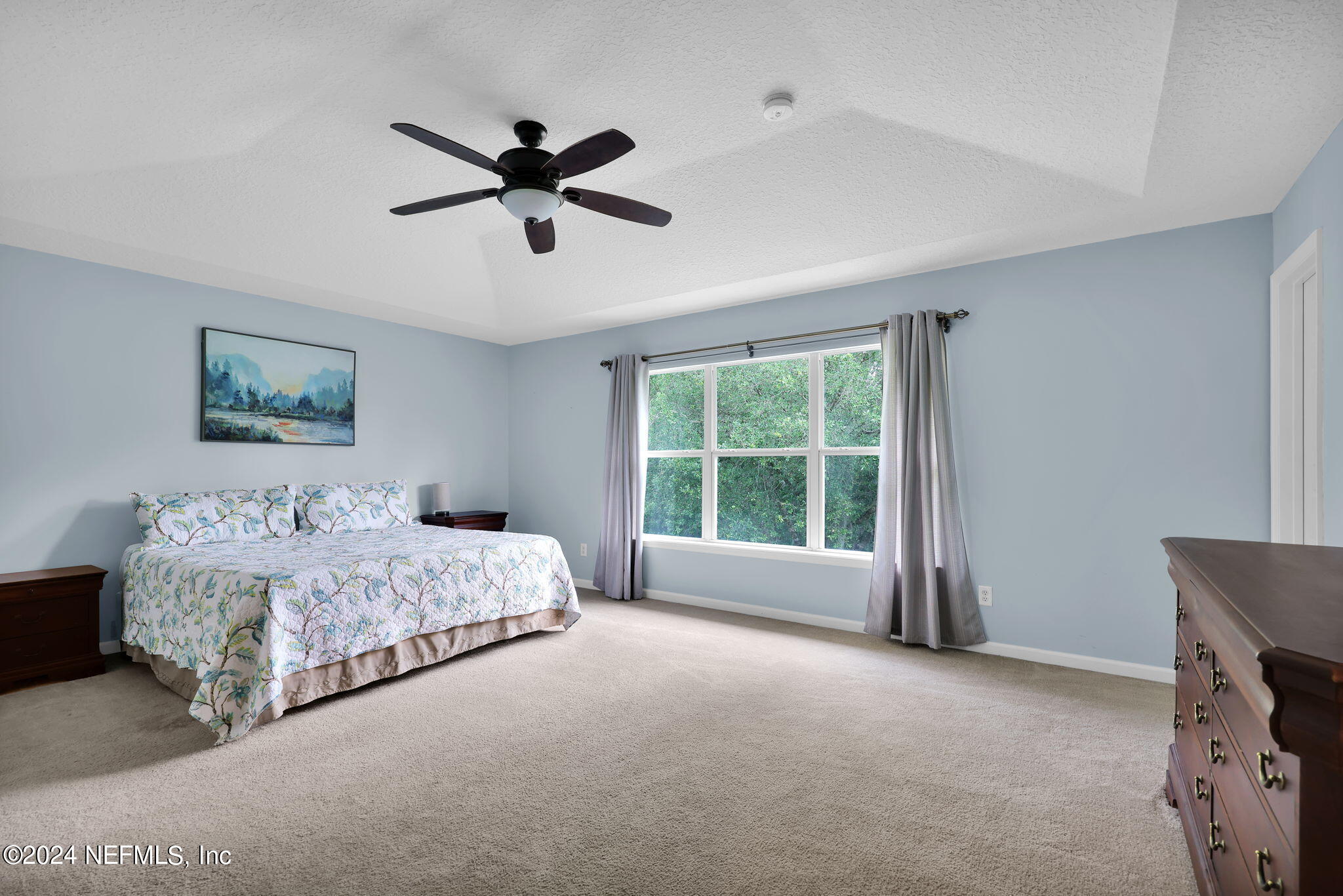 137 Castlegate Lane St. Johns, FL 32259 - Photo 29 of 65 a spacious bedroom with a bed and a window