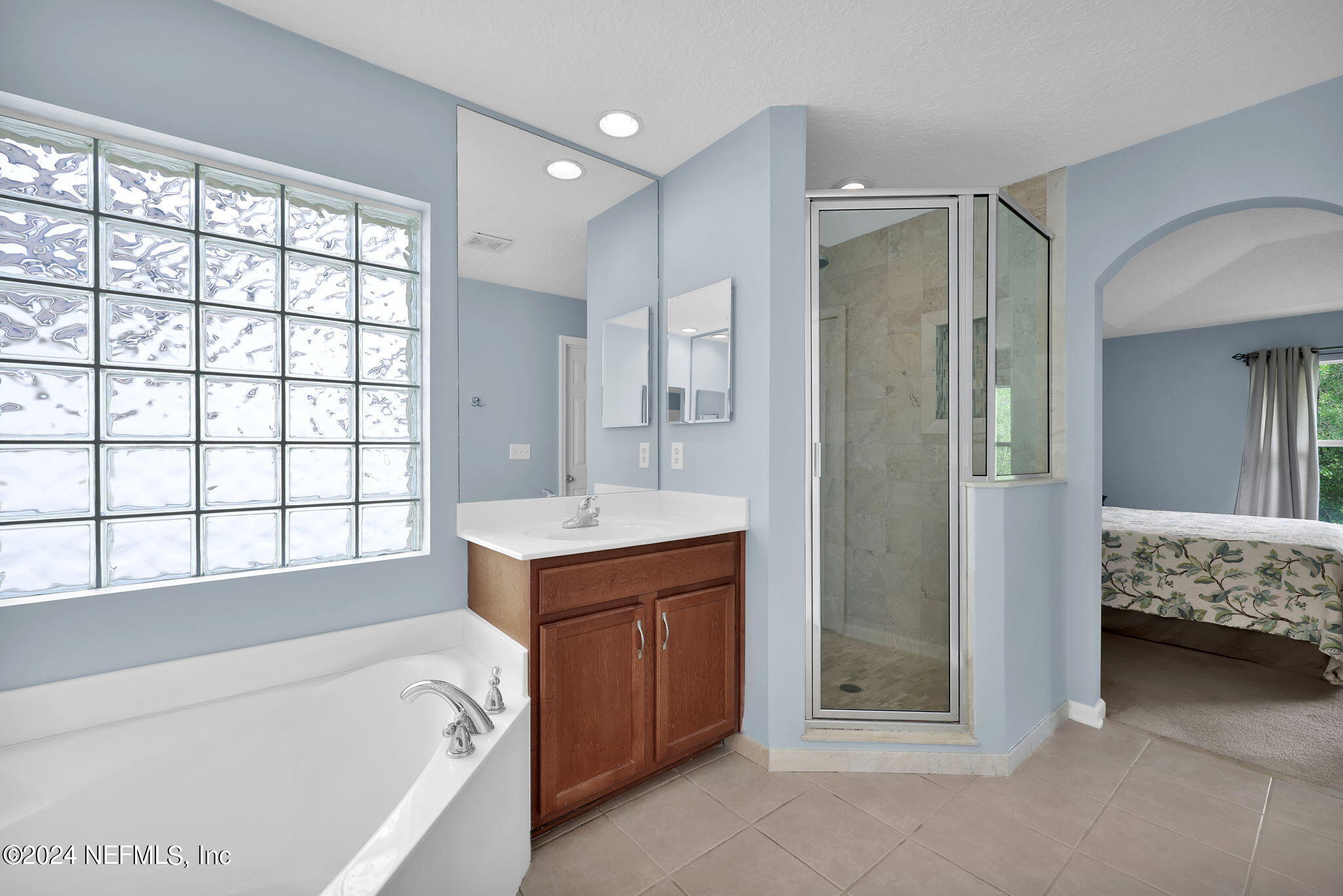 137 Castlegate Lane St. Johns, FL 32259 - Photo 33 of 65 a bathroom with a tub sink and mirror