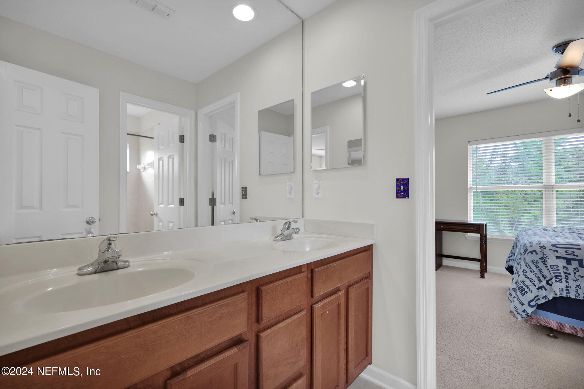 137 Castlegate Lane St. Johns, FL 32259 - Photo 39 of 65 a bathroom with 2 sink and a mirror
