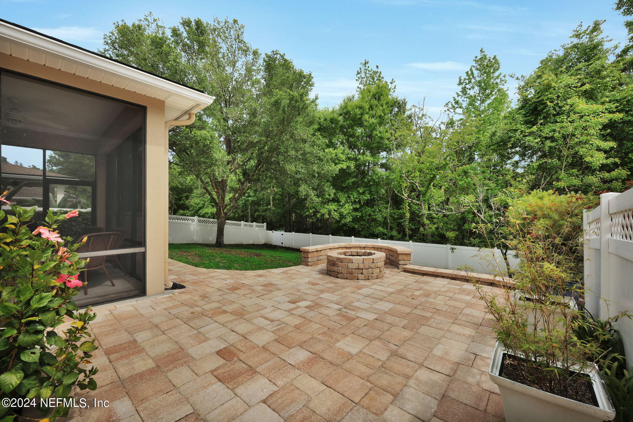 137 Castlegate Lane St. Johns, FL 32259 - Photo 42 of 65 a view of a backyard with potted plants and large trees