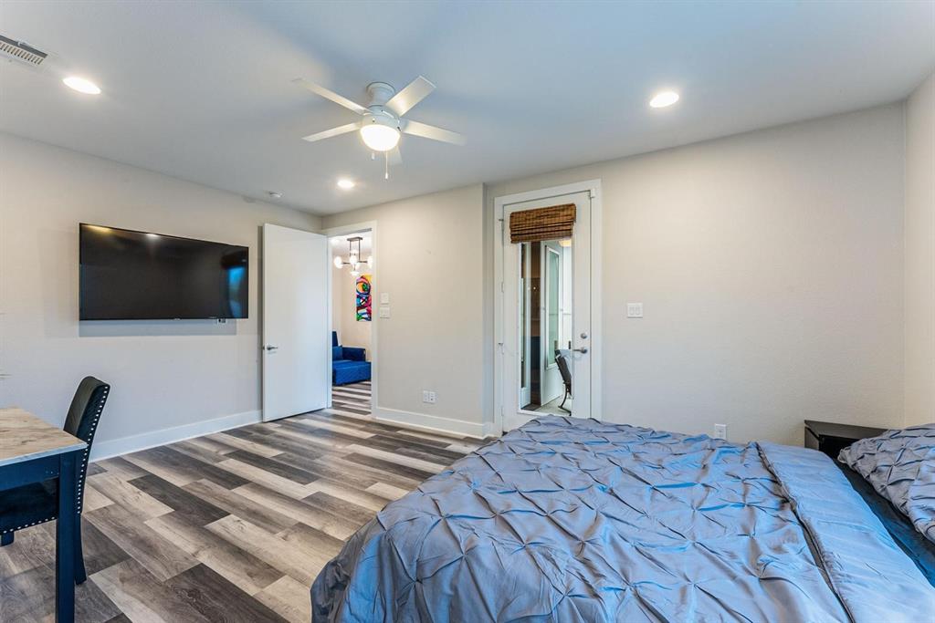 4013 Ivanhoe Lane Dallas, TX 75212 - Photo 15 of 38 Bedroom featuring hardwood / wood-style flooring and ceiling fan