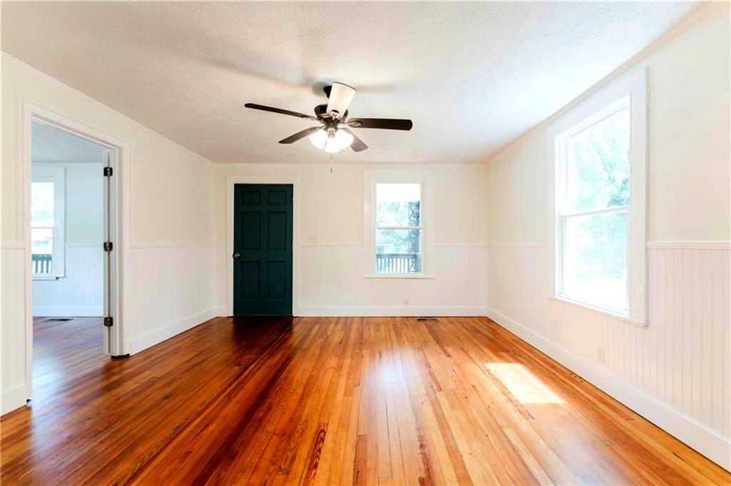 430 East 3rd Street Rome, GA 30161 - Photo 14 of 23 a view of empty room with wooden floor and fan