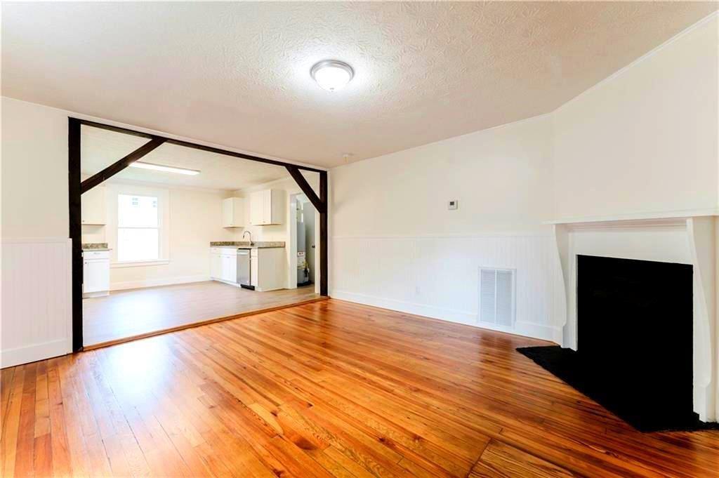 430 East 3rd Street Rome, GA 30161 - Photo 15 of 23 a view of empty room with wooden floor and fireplace