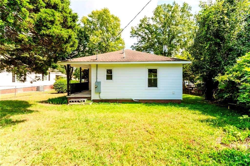 430 East 3rd Street Rome, GA 30161 - Photo 21 of 23 a view of a house with pool and a yard