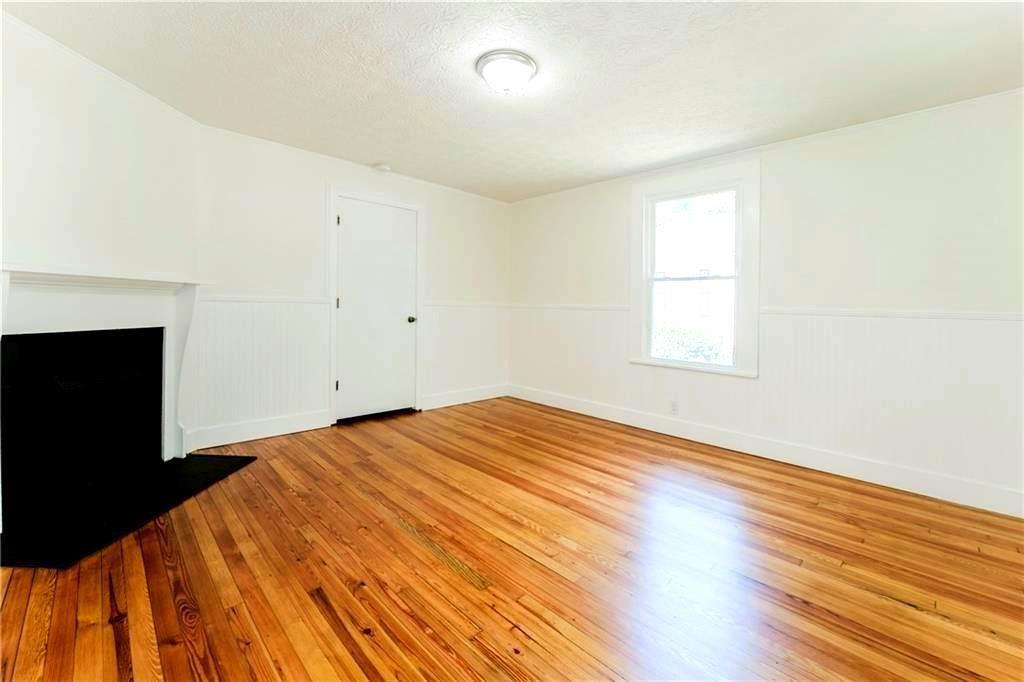 430 East 3rd Street Rome, GA 30161 - Photo 5 of 23 an empty room with wooden floor and windows