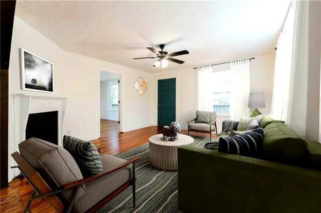 a living room with furniture and a fireplace