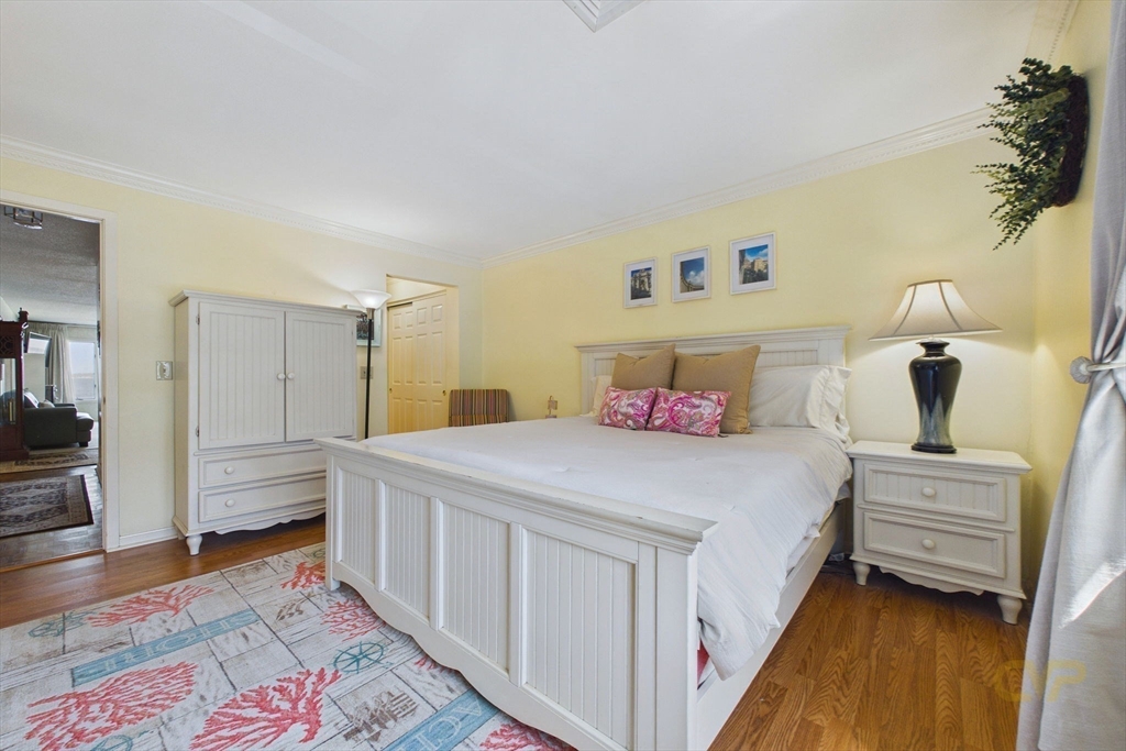 700 Shore Drive, Unit 509 Fall River, MA 02721 - Photo 14 of 25 a bedroom with a bed and a view of bathroom