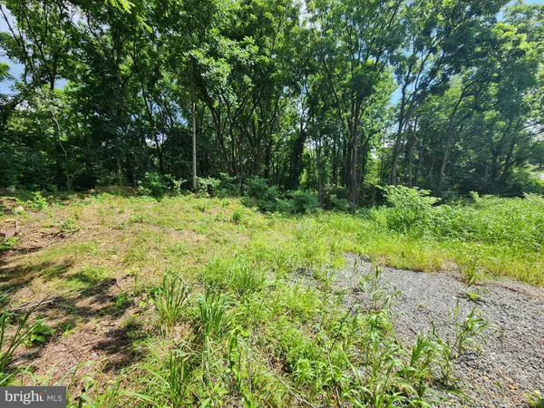 a fire hydrant in the middle of a field