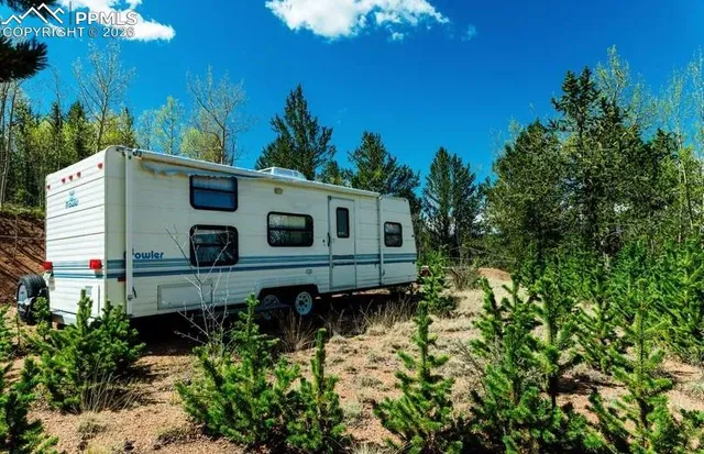 a back view of a house with a yard