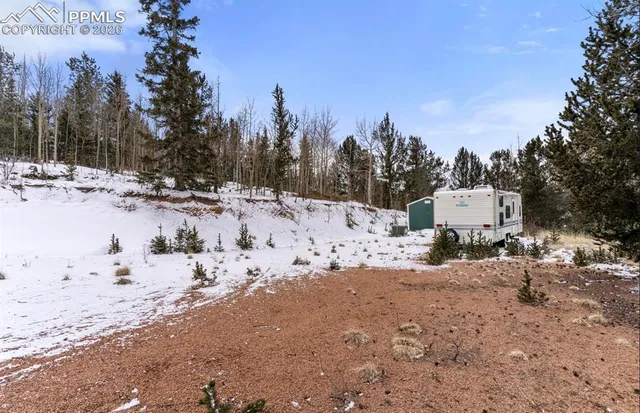 a view of a snow on the road