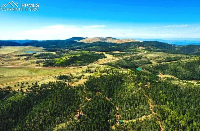a view of an ocean and mountain