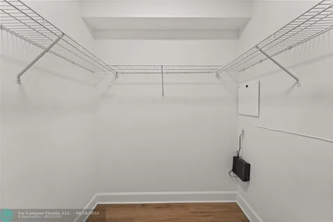 a workspace with furniture window and wooden floor