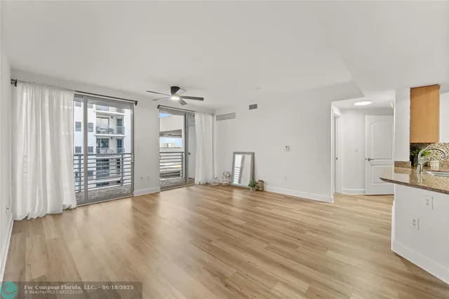 a kitchen with stainless steel appliances granite countertop a stove a sink dishwasher and a refrigerator