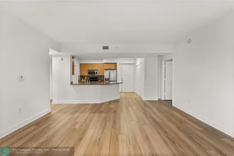 a view of living room and wooden floor