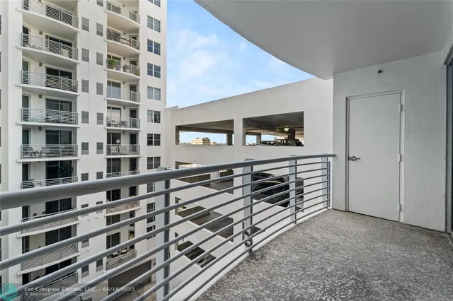 a bathroom with a granite countertop sink a mirror and shower