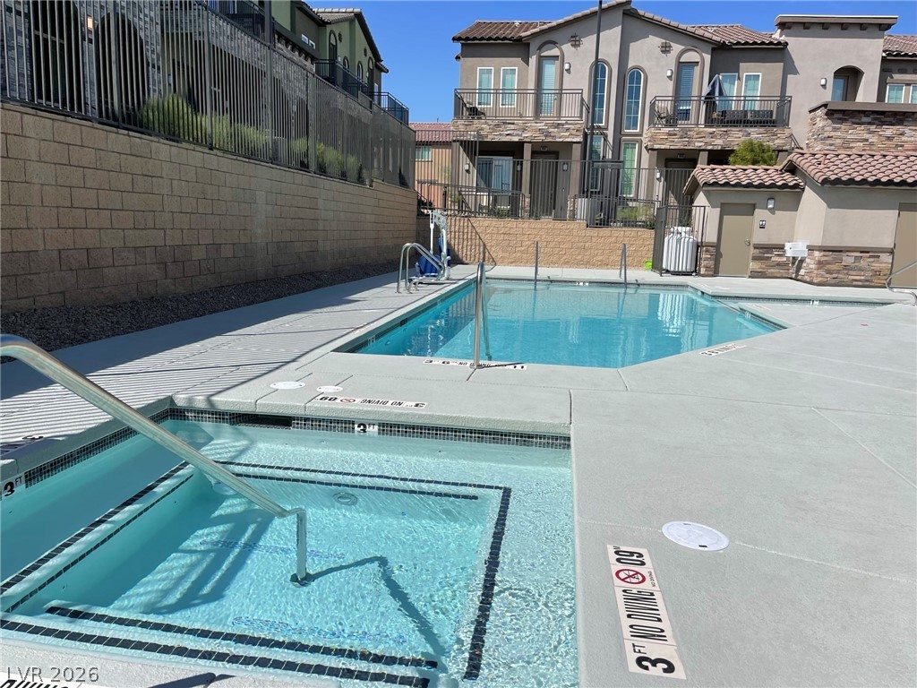 6444 Spring Jog Street Las Vegas, NV 89166 - Photo 10 of 13 Relax and refresh in the inviting pool area, perfect for sunny days.