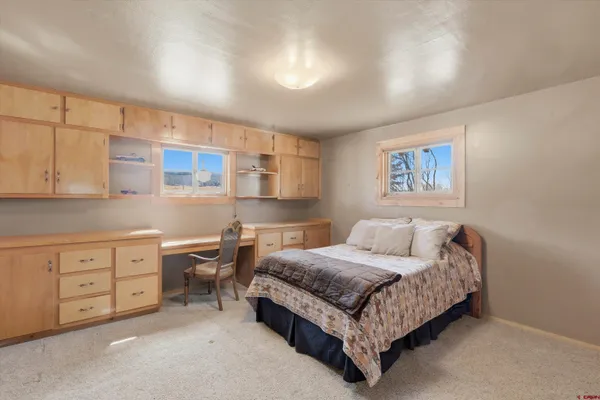 a view of a room with wooden walls