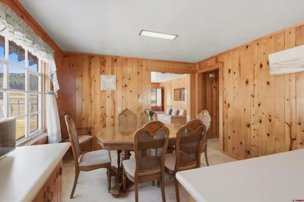 a kitchen with stainless steel appliances a refrigerator and a stove top oven