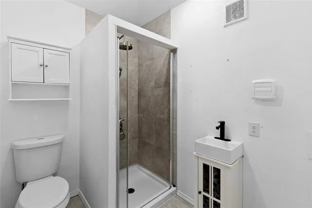 a view of yard with wooden fence