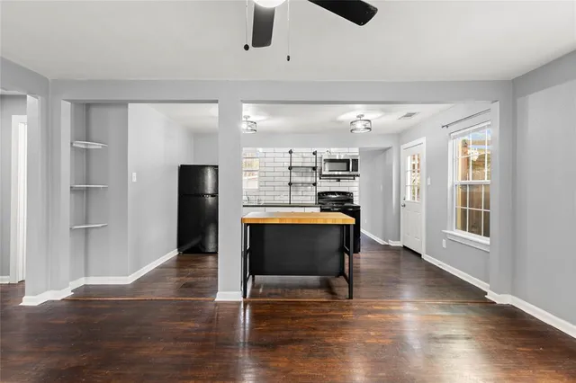 a kitchen with stainless steel appliances granite countertop a stove and a refrigerator
