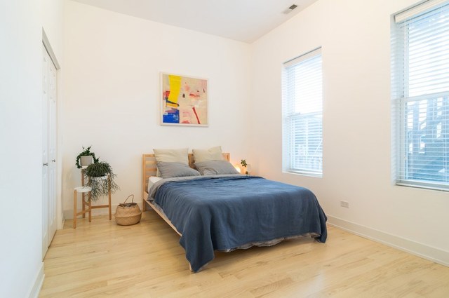 2441 West Harrison Street, Unit 1 Chicago, IL 60612 - Photo 6 of 10 a bedroom with a bed and a window