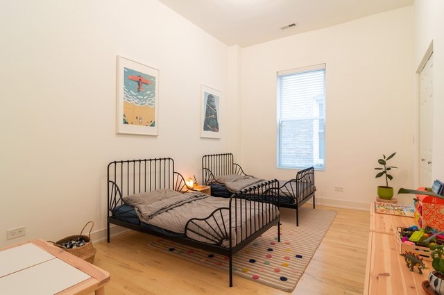 2441 West Harrison Street, Unit 1 Chicago, IL 60612 - Photo 7 of 10 a living room with furniture and a window