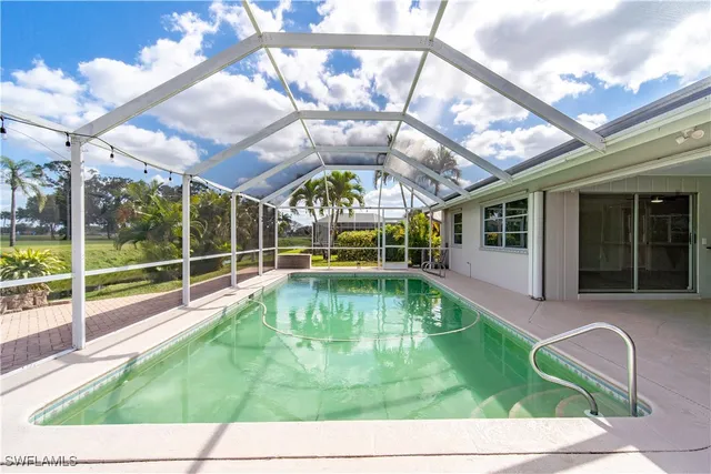 a view of a swimming pool with a patio