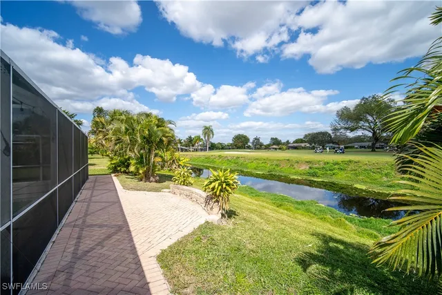a view of a swimming pool with a patio