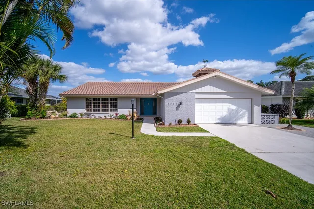 a front view of a house with a garden and porch