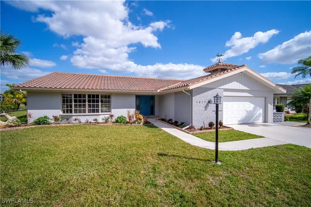 a house with swimming pool in front of it