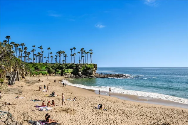 a view of a beach with a ocean view in back