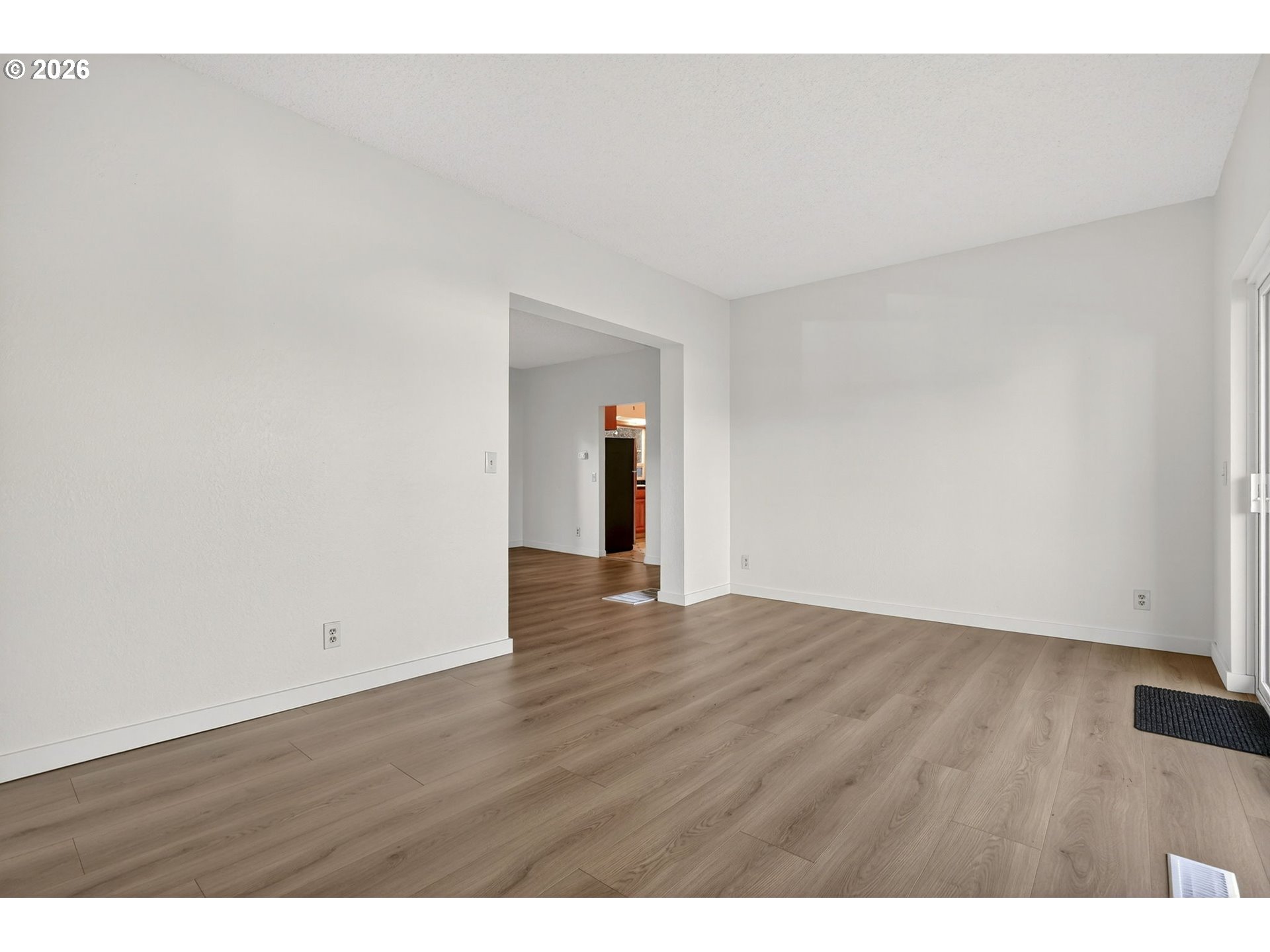 5249 Northeast 45th Place Portland, OR 97218 - Photo 11 of 48 a view of an empty room and wooden floor