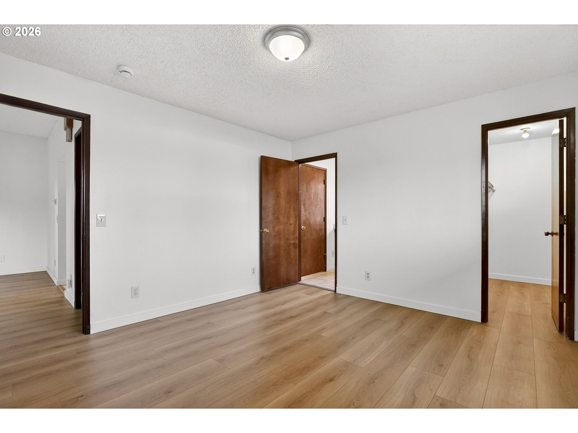 5249 Northeast 45th Place Portland, OR 97218 - Photo 21 of 48 a view of an empty room with wooden floor