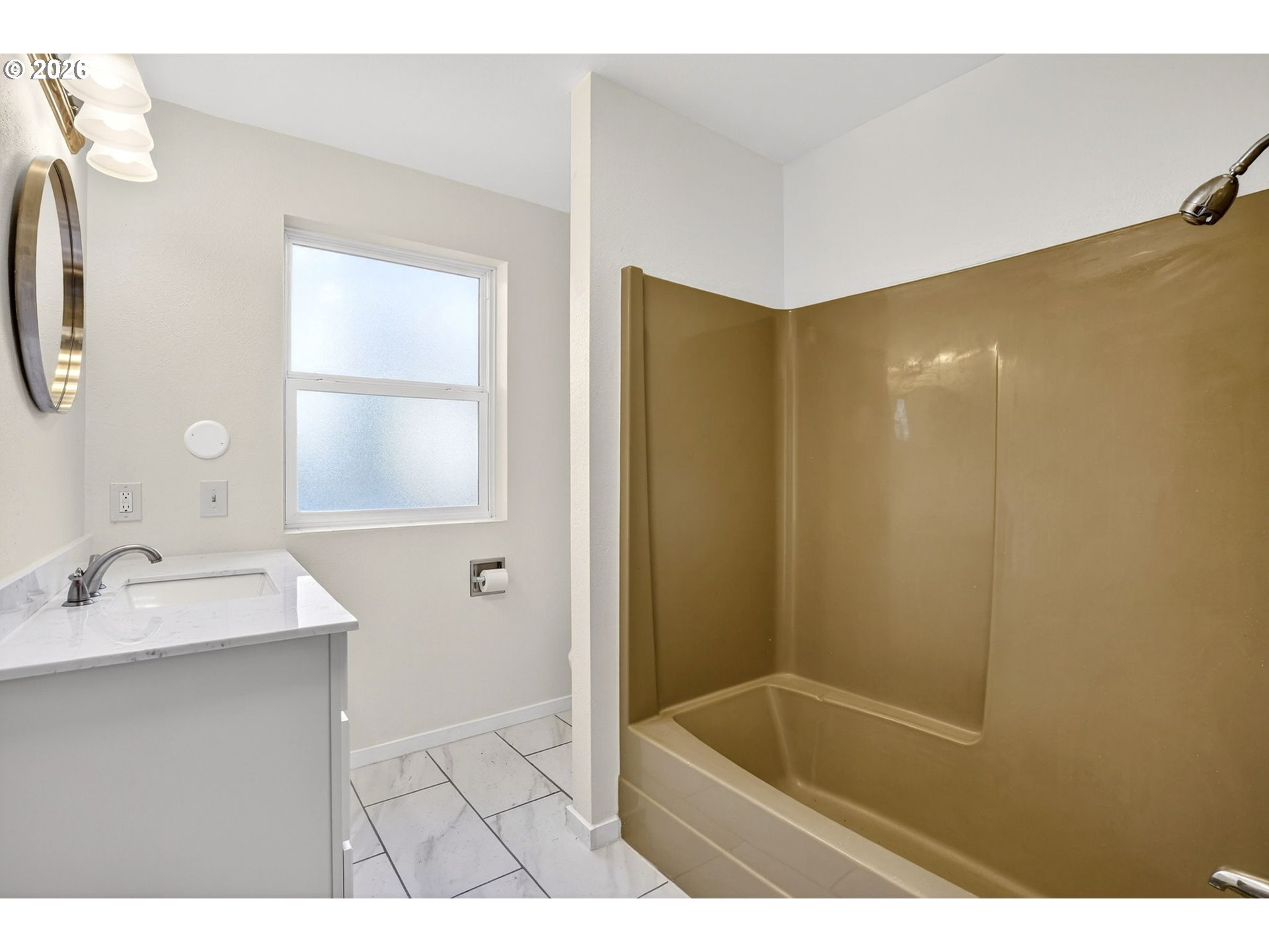 5249 Northeast 45th Place Portland, OR 97218 - Photo 23 of 48 a bathroom with a tub sink and mirror