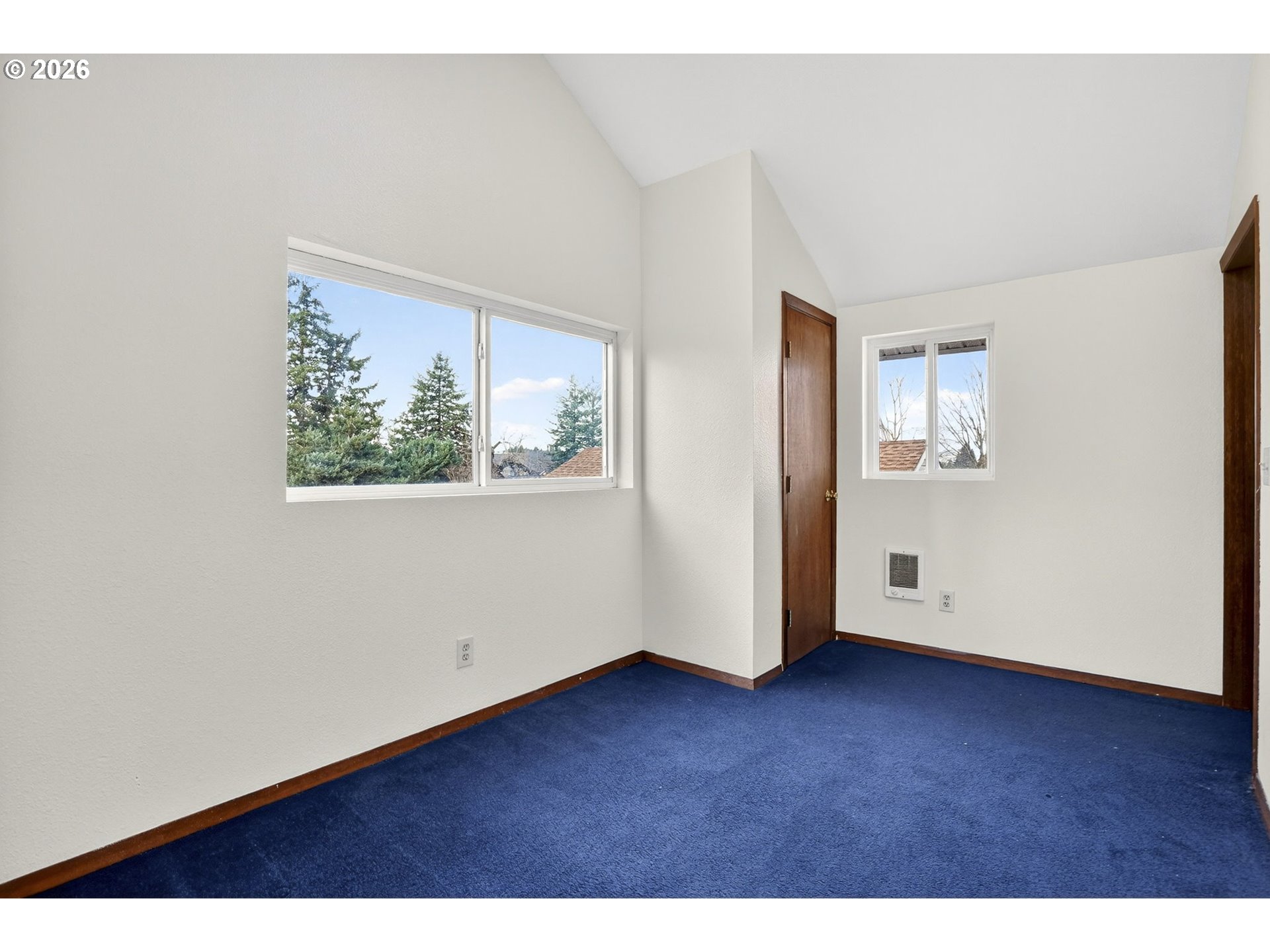 5249 Northeast 45th Place Portland, OR 97218 - Photo 32 of 48 a view of an empty room with wooden floor and a window