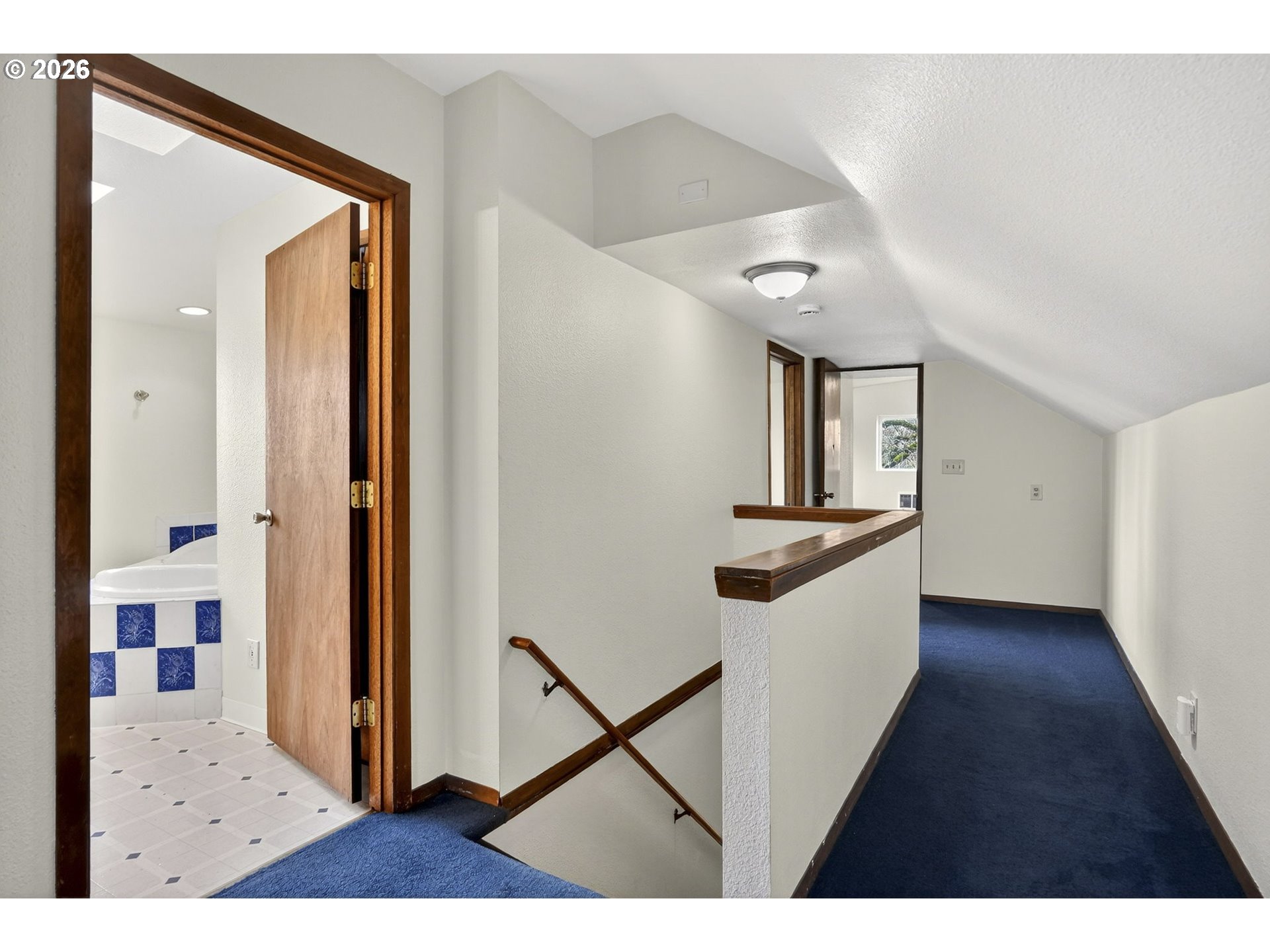 5249 Northeast 45th Place Portland, OR 97218 - Photo 36 of 48 a view of a hallway view with wooden floor and staircase