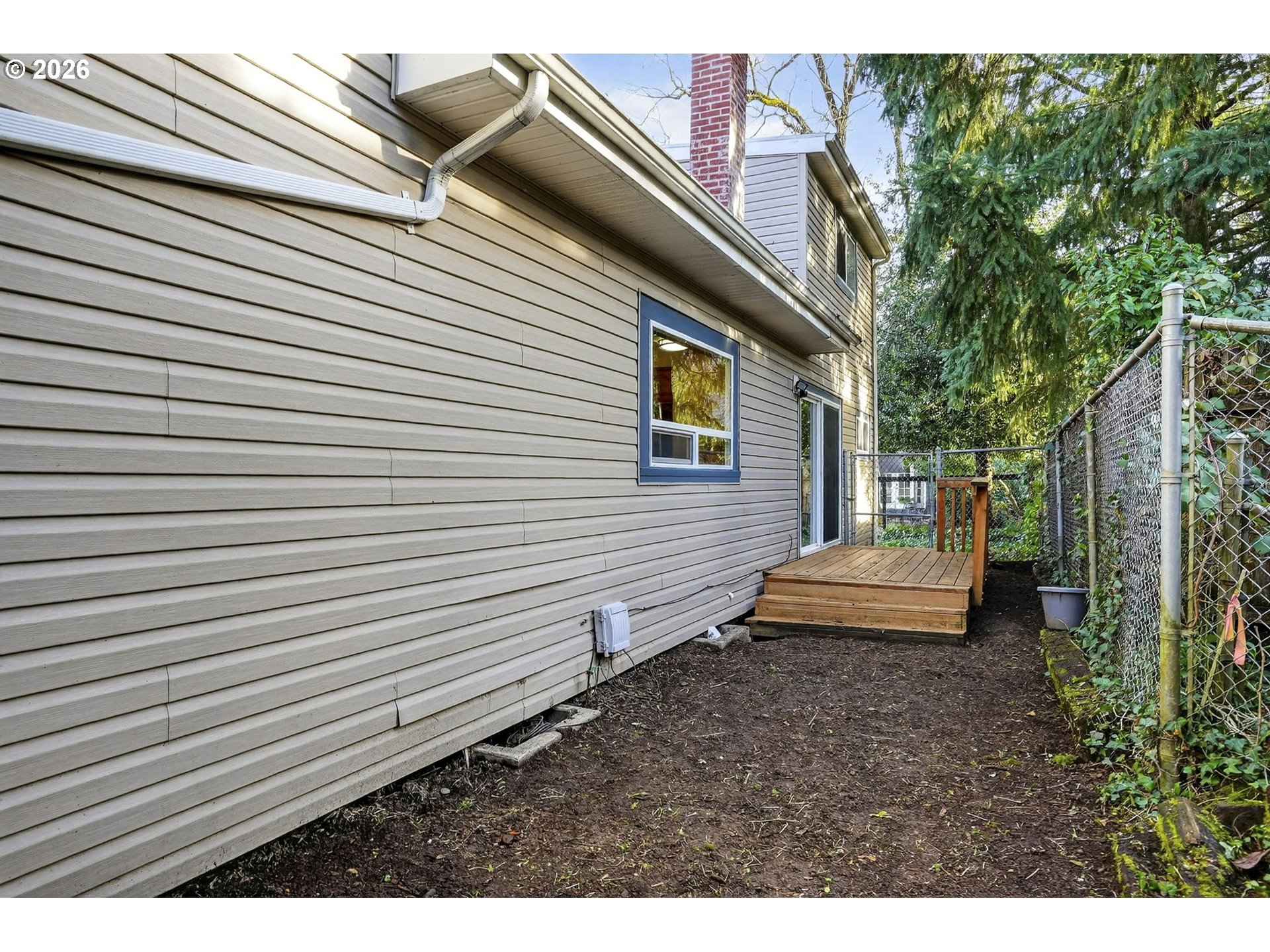 5249 Northeast 45th Place Portland, OR 97218 - Photo 40 of 48 a view of a patio with a table and chairs and wooden floor