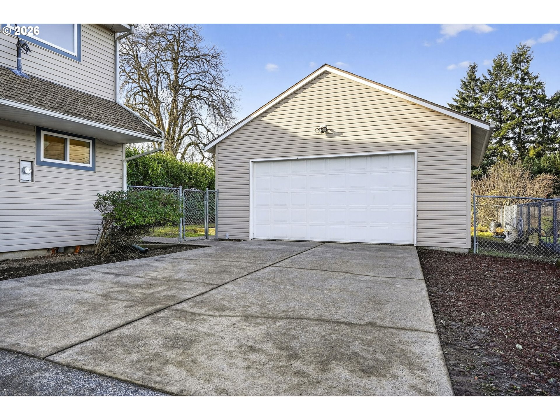 5249 Northeast 45th Place Portland, OR 97218 - Photo 41 of 48 a front view of a house with a yard and garage