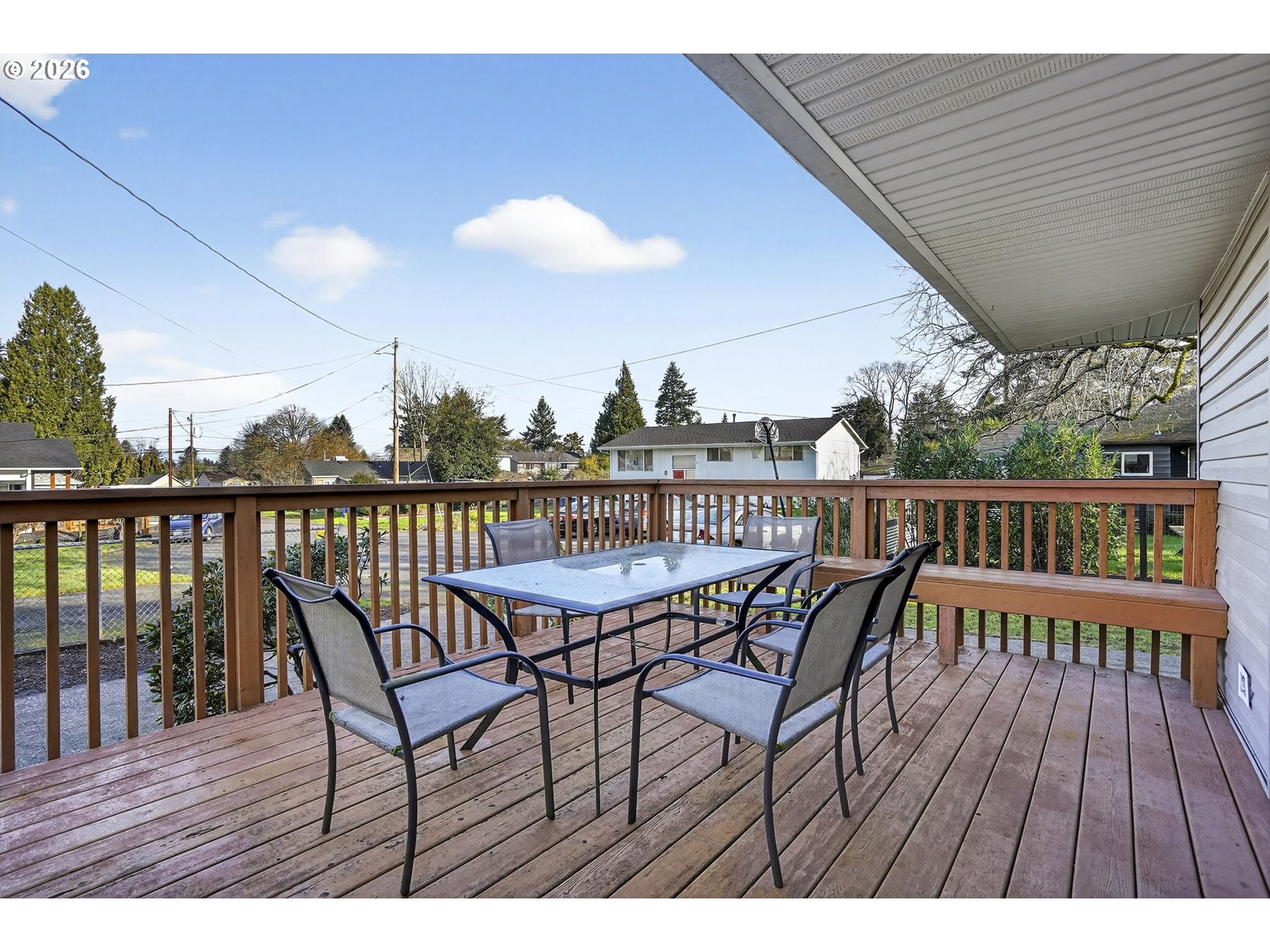 5249 Northeast 45th Place Portland, OR 97218 - Photo 48 of 48 a view of a roof deck with table and chairs a barbeque with wooden floor