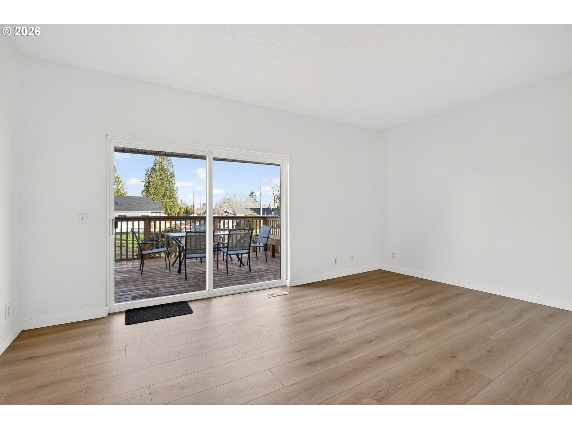 5249 Northeast 45th Place Portland, OR 97218 - Photo 9 of 48 a view of an empty room with wooden floor